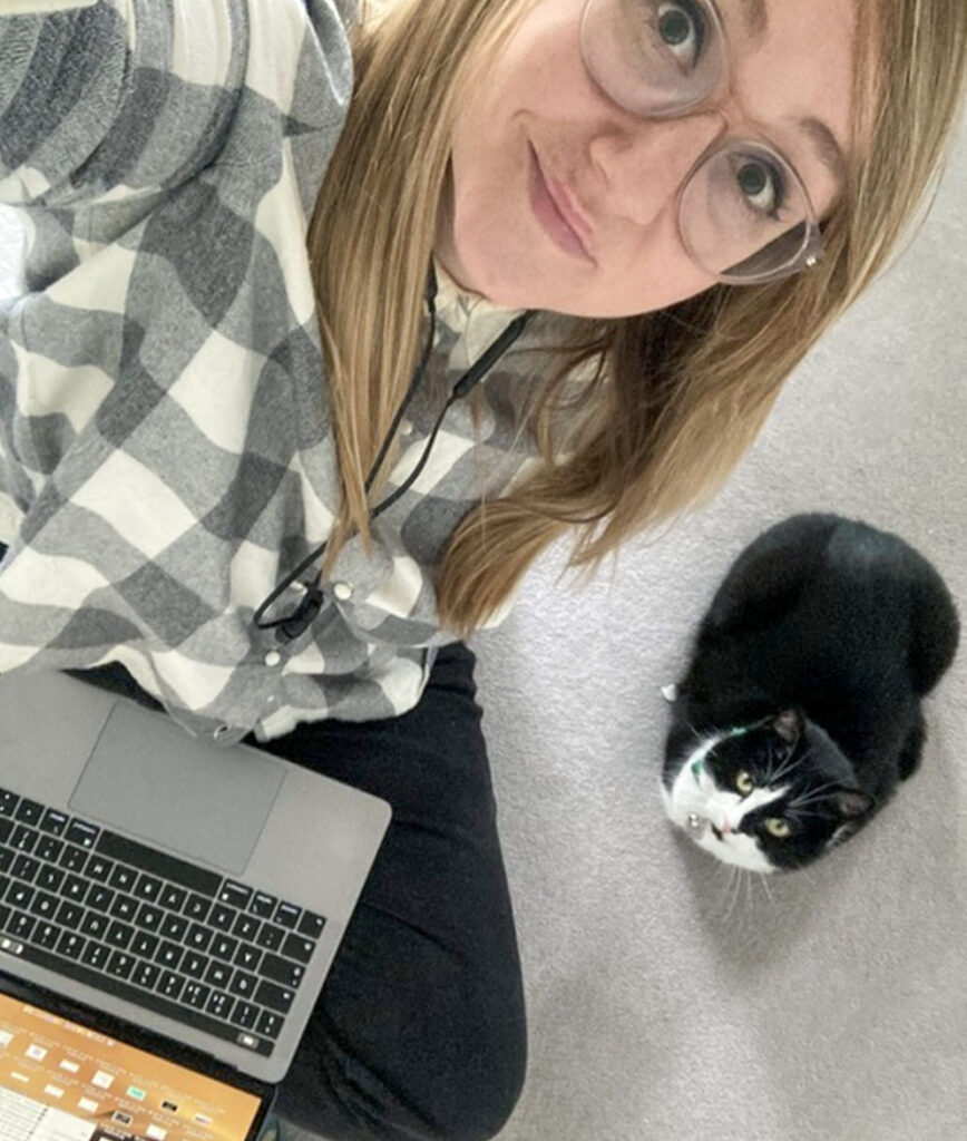 Raw London's Marketing Director, Charlotte Harris working from home with her cat, Billie
